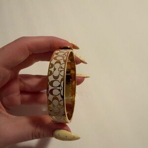 Coach Gold-Tone Cream Patterned Hinged Bangle Bracelet
